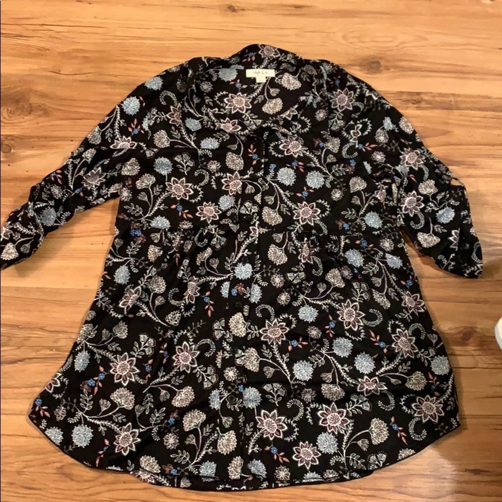 Light floral button down with flared bottom.